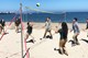 Play beach side volleyball with your team